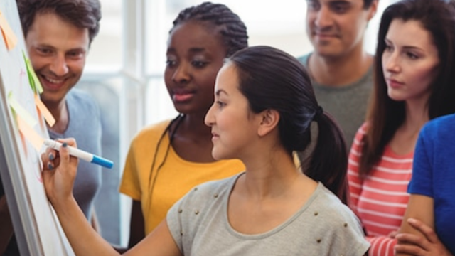 ACTIVE© Project Management (1.5 Day) group training session with diverse team collaborating at a whiteboard