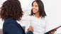 Two women talking and smiling at the ACTIVE© Data Analysis for Systemic Decision Making - Group Training (5 x half days).
