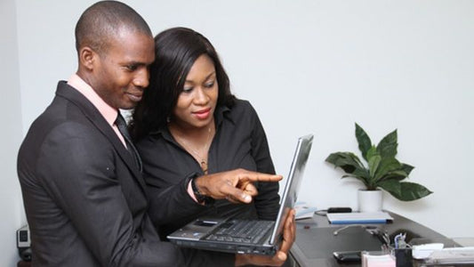 Develop Best Practices for ACTIVE© Leaders – Group Training session with two professionals collaborating on a laptop.