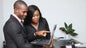 Develop Best Practices for ACTIVE© Leaders – Group Training session with two professionals collaborating on a laptop.