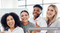Four diverse professionals smiling and giving thumbs up during the Levels of ACTIVE Leadership Programme group training