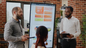 Group of people standing around an analytic board US12433 | Effective Workplace Communication for ACTIVE© Leaders 