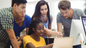 Group of people looking at a screen 